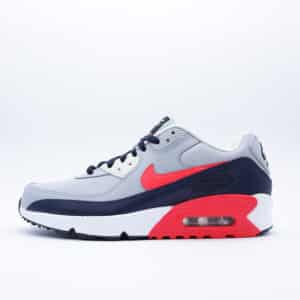 Tenis Nike Air Max 90 para hombre y mujer, en colores gris, azul marino y rojo brillante. Diseño clásico con unidad Air.