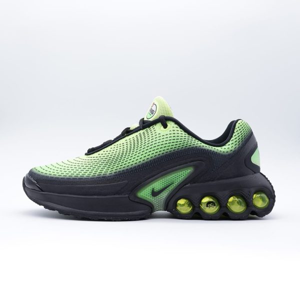 Tenis Nike Air Max Dn para hombre en negro y verde limón. Tenis deportivos con tecnología de amortiguación visible, malla técnica y diseño moderno.